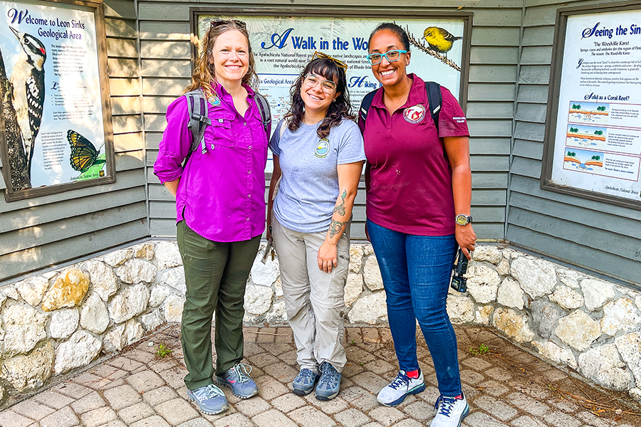Amanda Tazaz with two colleagues posing for a photo outdoors at a Florida State Park
