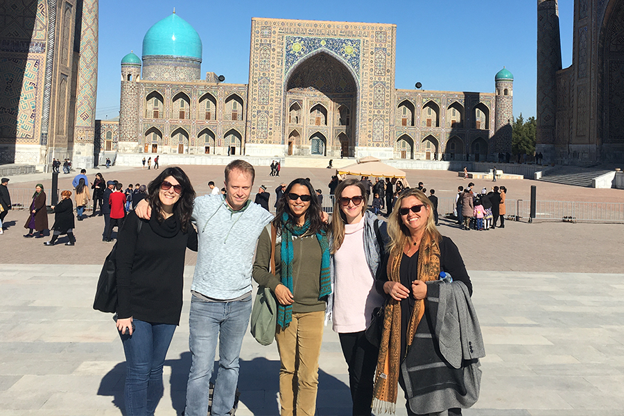 Flavia Ramos-Mattoussi posing with four colleagues in Uzbekistan