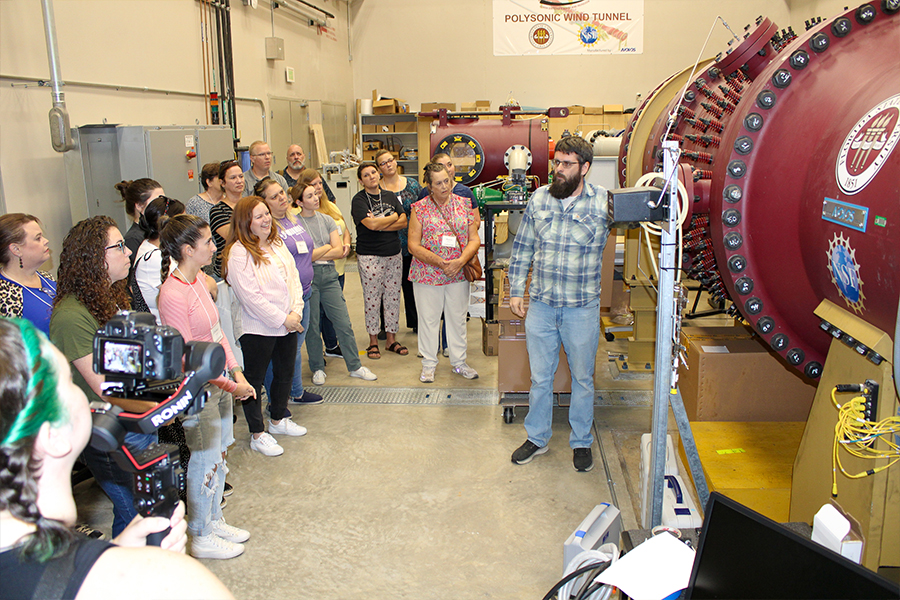 "Group listening to a presentation at FSU's polysonic wind tunnel at the Florida Center for Advanced Aero-Propulsion"