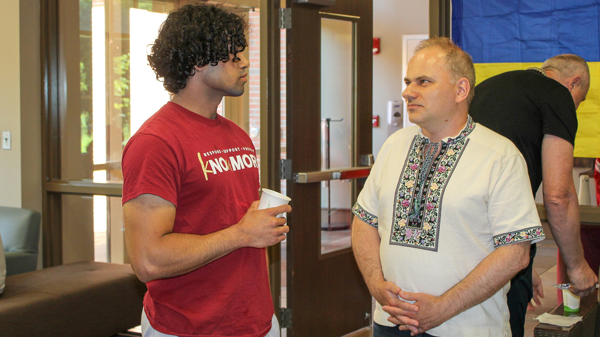 "Dr. Taras Panchenko talking with an FSU student"