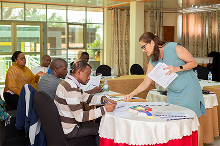 "Dr. Marty working with participants at a workshop."