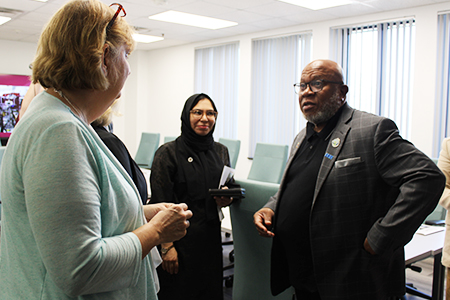 "Gena St. John in discussion with the President of the United Nations General Assembly Dennis Francis"