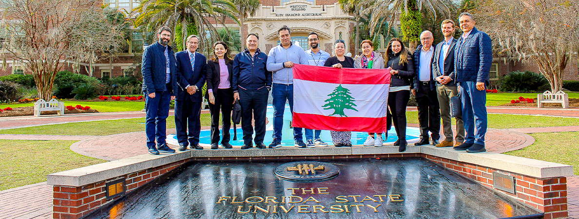 "Group holding the flag of Lebanon while posing for a photo at FSU's Westcott fountain."