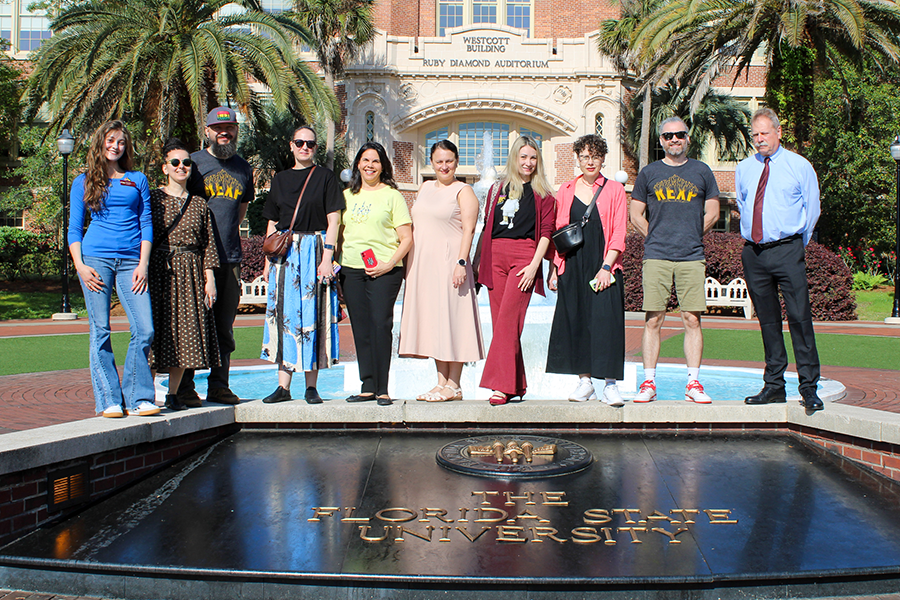 DakhaBrakha posing for a group photo outside of Westcott at the fountain.