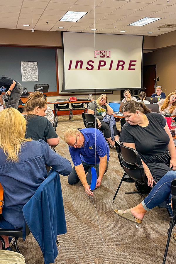 Jim Reynolds conducting an experiment in a classroom.