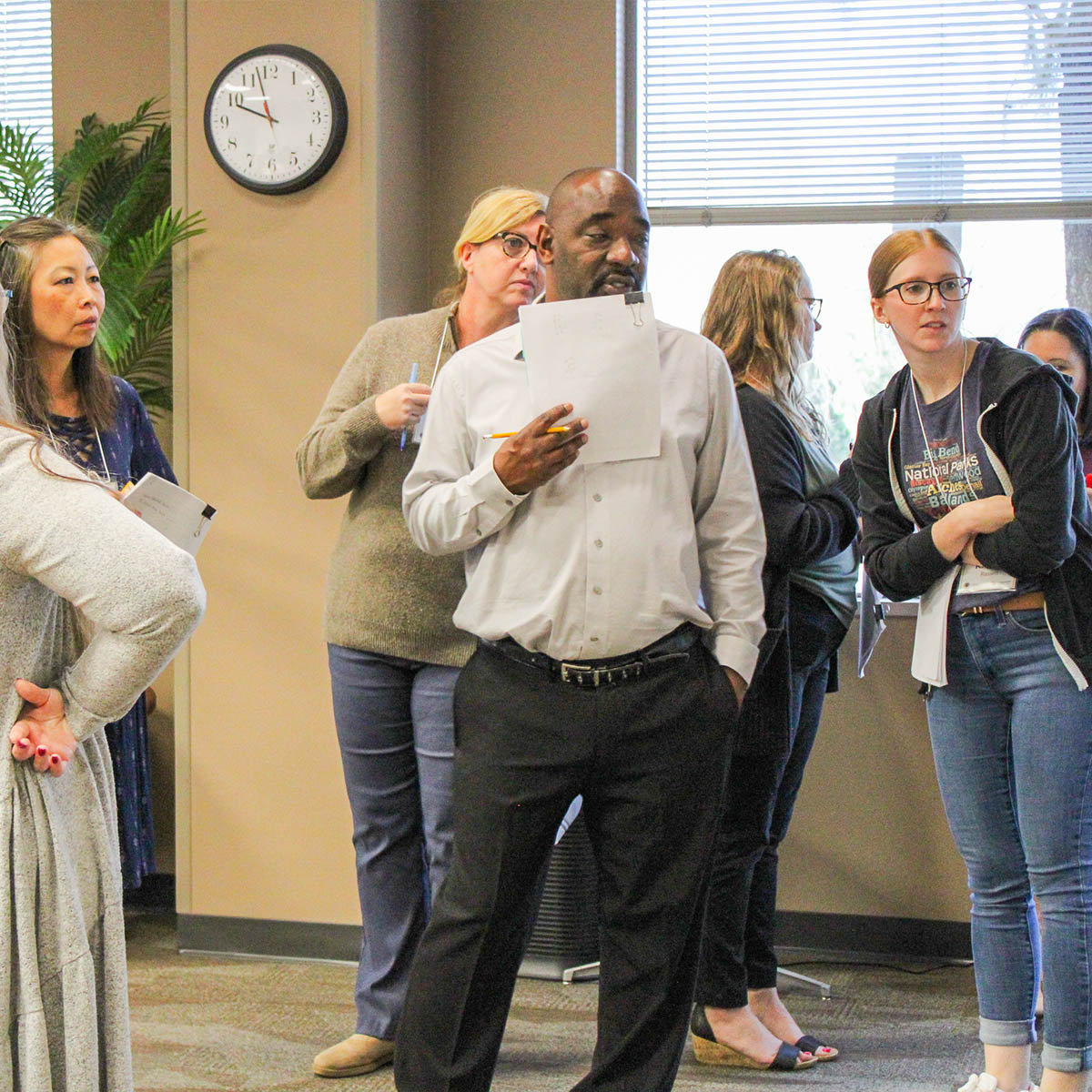 Small group working together during an math assessment writing workshop in Tallahassee.