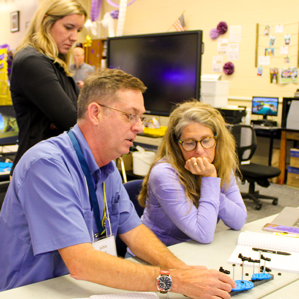 Two participants in ROBO101 working on a project in Gulf County.