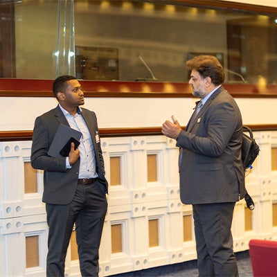 LSI Director Rabieh Razzouk in discussion with another man.