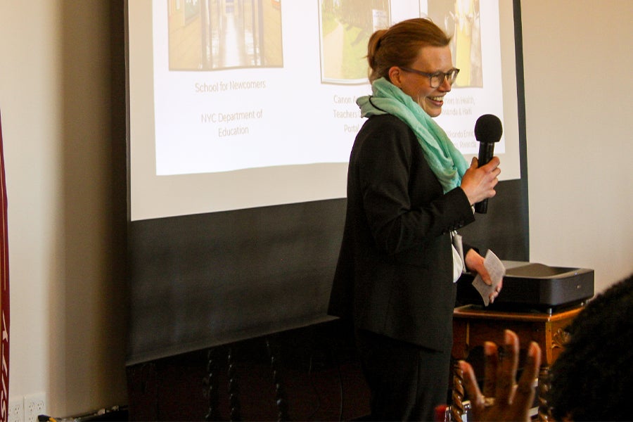 Photo of Celia Reddick presenting in front of a screen