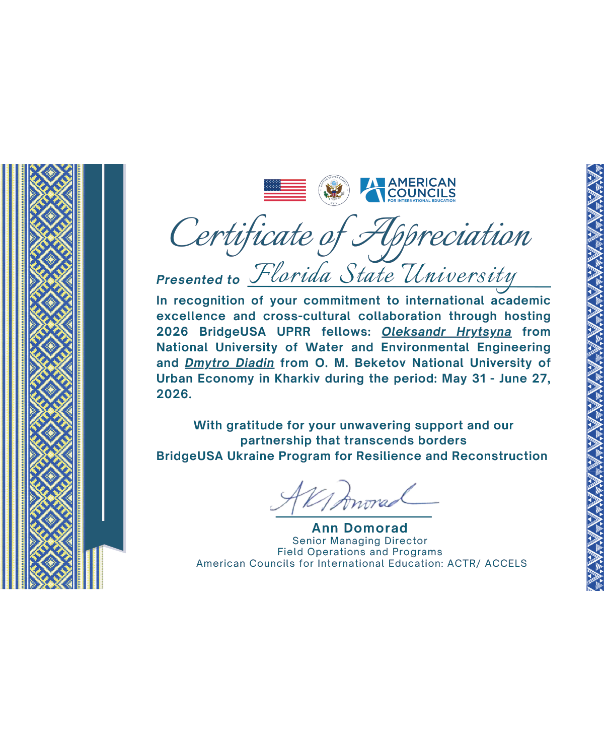Certificate of Appreciation from American Councils for International Education recognizing Florida State University for its commitment to international academic excellence and cross-cultural collaboration through hosting 2026 BridgeUSA UPRR fellows Oleksandr Hrytsyna and Dmytro Diadin from Ukrainian universities. The certificate features the U.S. flag, the U.S. Embassy Kyiv seal, and the American Councils logo, with blue and yellow Ukrainian-inspired decorative borders. It acknowledges the fellowship period of May 31 to June 27, 2026, and expresses gratitude for supporting the BridgeUSA Ukraine Program for Resilience and Reconstruction. The certificate is signed by Ann Domorad, Senior Managing Director of Field Operations and Programs at American Councils for International Education.