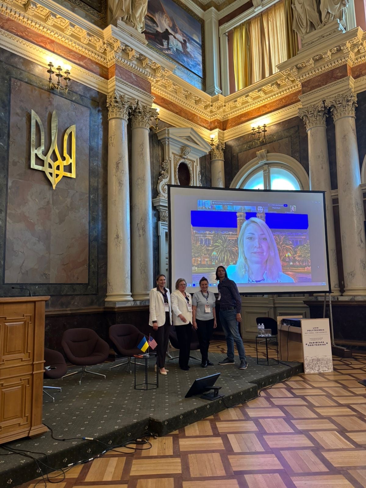  Anna Romanova on a large screen following a presentation at the U.S. Science and Education Forum at the Lviv Academic Bridge.&nbsp;