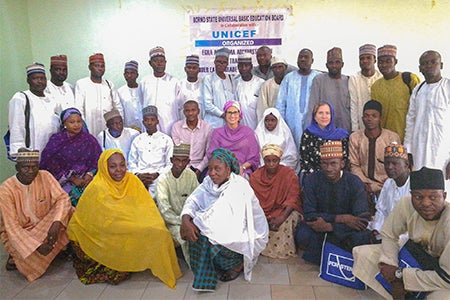Ana H. Marty posing in a group photos during research in Nigeria