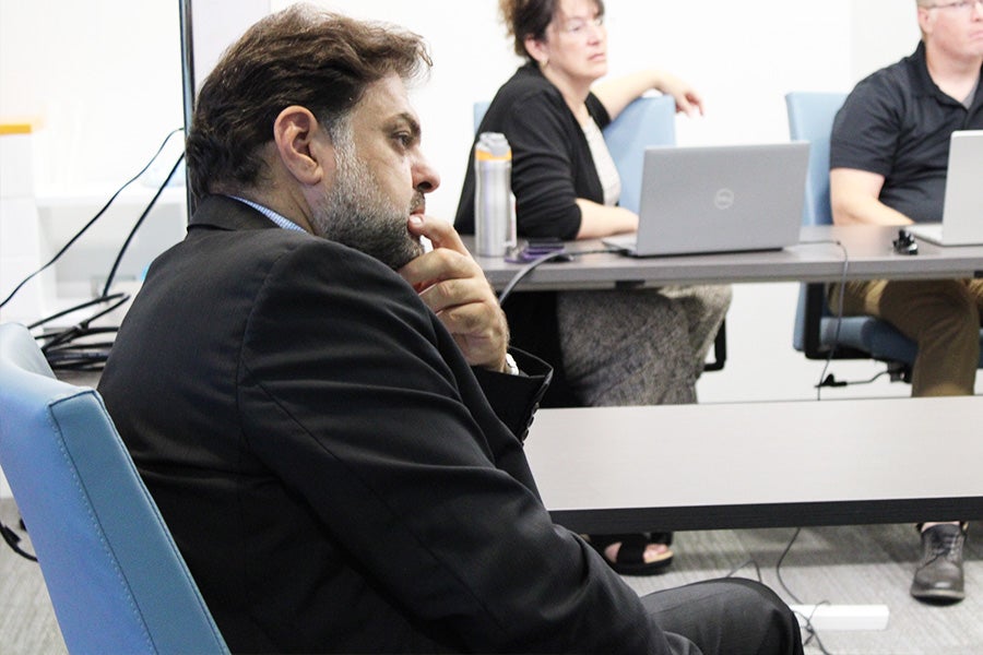 Rabieh Razzouk in a conference room at a meeting