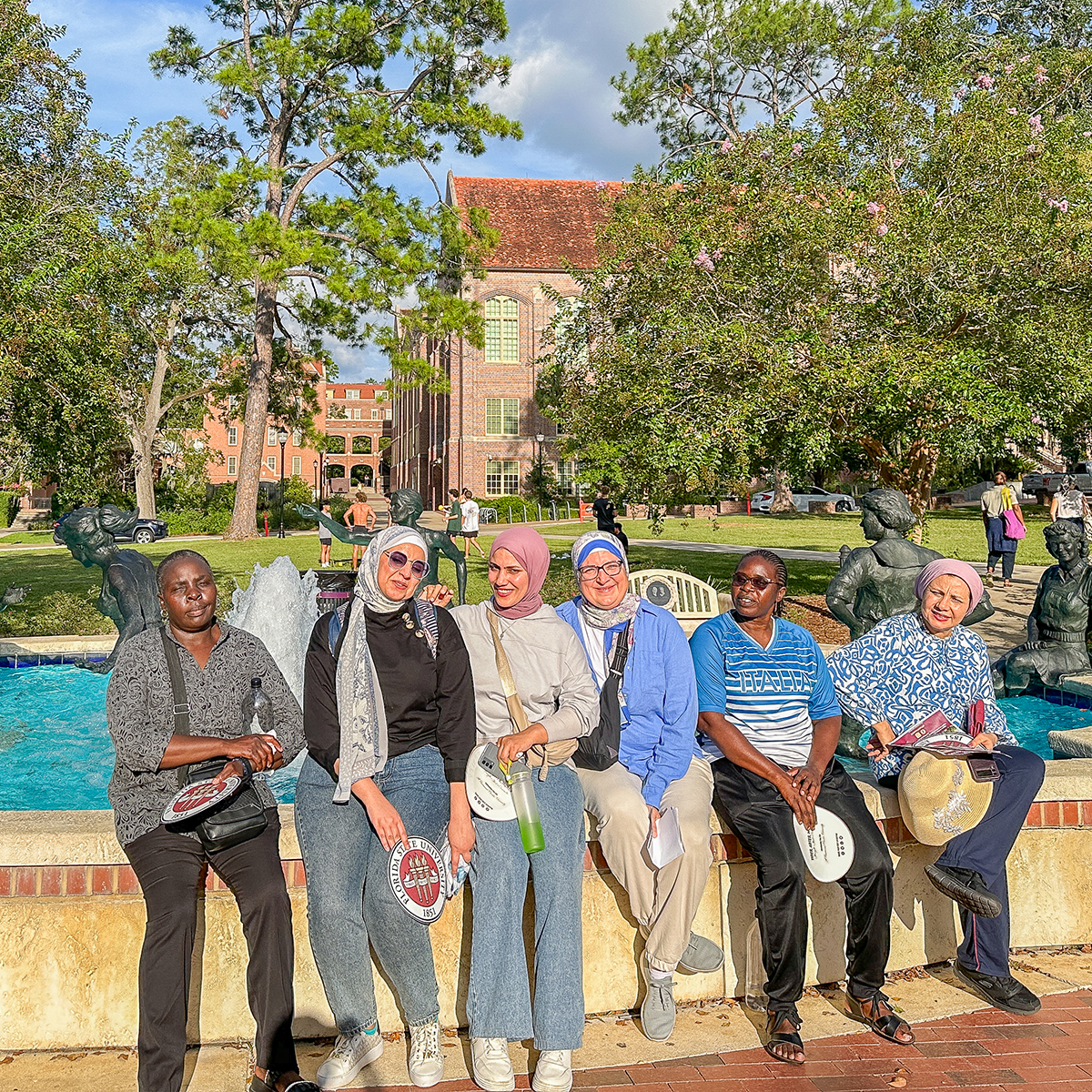 "Egyptian fellows posing for a photo with two Zambian fellows on the FSU campus."