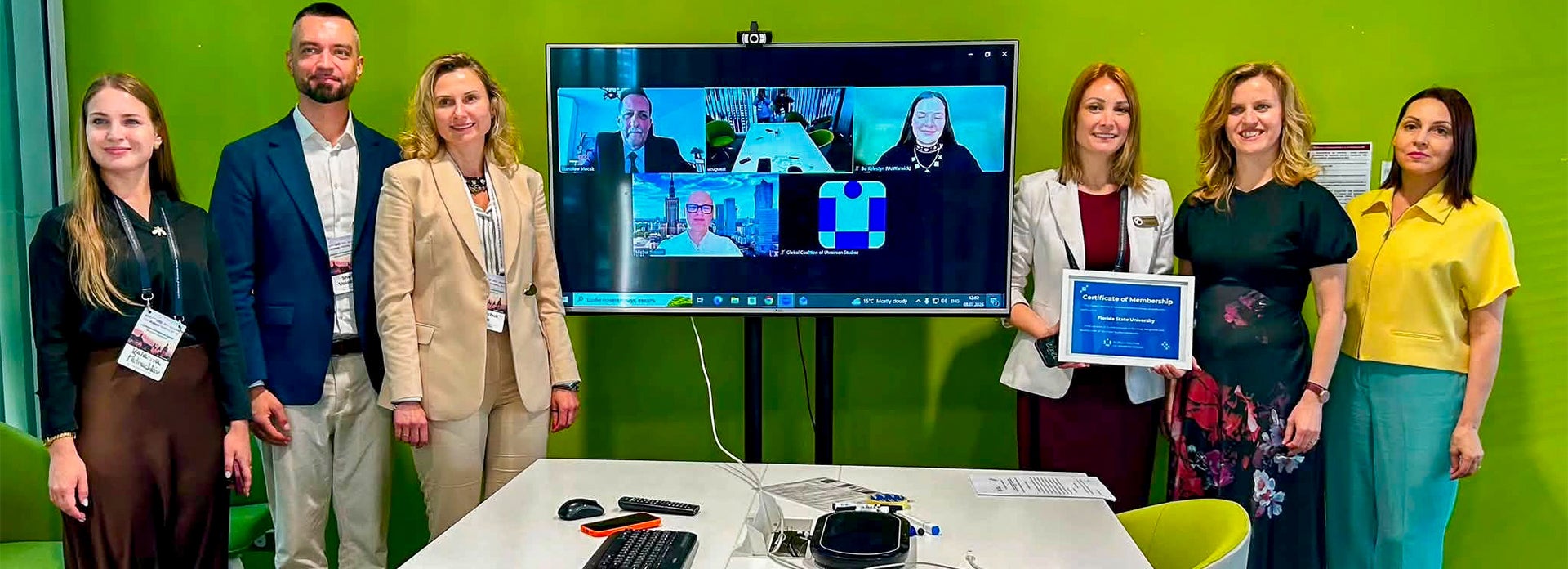Dr. Anna Romanova standing with a group at a conference in Lviv, Ukraine.