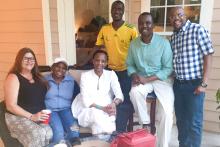Small group posing on an outdoor patio