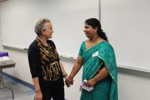 A member of the India CCAP Group holding hands with another person