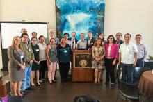 CCAP Brazil, Colombia, Ecuador and Peru group photo around a podium at Sante Fe COllege