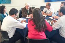 Group of people around a table with inside Santa Fe College
