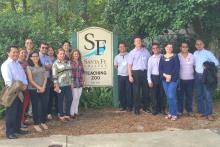 Group photo in front of a Santa Fe College sign