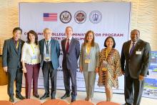 Group photo in front of a large CCAP sign
