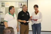 Two member of the CCAP Ukraine group at the front of a room with the director of public safety at Santa Fe College