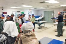 CCAP Indonesia group members standing in a classroom with medical equopment
