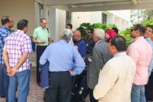 Members of the CCAP Egypt group standing outside around a man addressing the group
