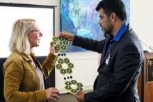 A member of the CCAP Pakistan group presenting a gift to a member of the Santa Fe College staff