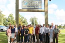 Group photo outside in front of the Santa Fe College Teaching Zoo