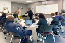 CCAP South Africa group members listening to a presentation inside a classroom at Santa Fe College
