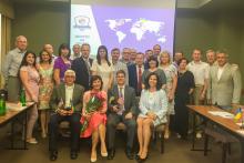 Ukraine CCAP group posing inside a classroom in front of a projection screen