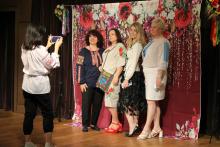 A group of guests in Ukrainian Vyshyvankas poses for a photo at a celebration on the FSU campus.