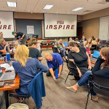 Jim Reynolds conducting a demonstration for a group of teachers in a classroom. 