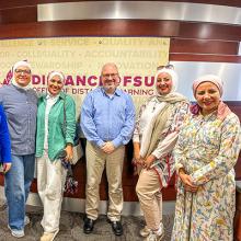 Egyptian fellows posing for a photo with two FSU employees in the Office of Distance Learning.
