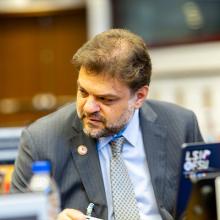 LSI Director Rabieh Razzouk sitting behind a laptop in discussion.