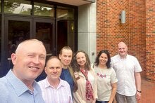 Group photo with Dr. Dina Vyortkina, Dr. Vilma Fuentes and BridgeUSA participants in front of Anne's College on the FSU campus. 