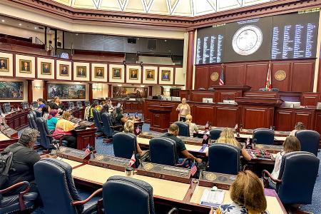 Florida teachers visiting the Florida state legislature sitting in the chamber,