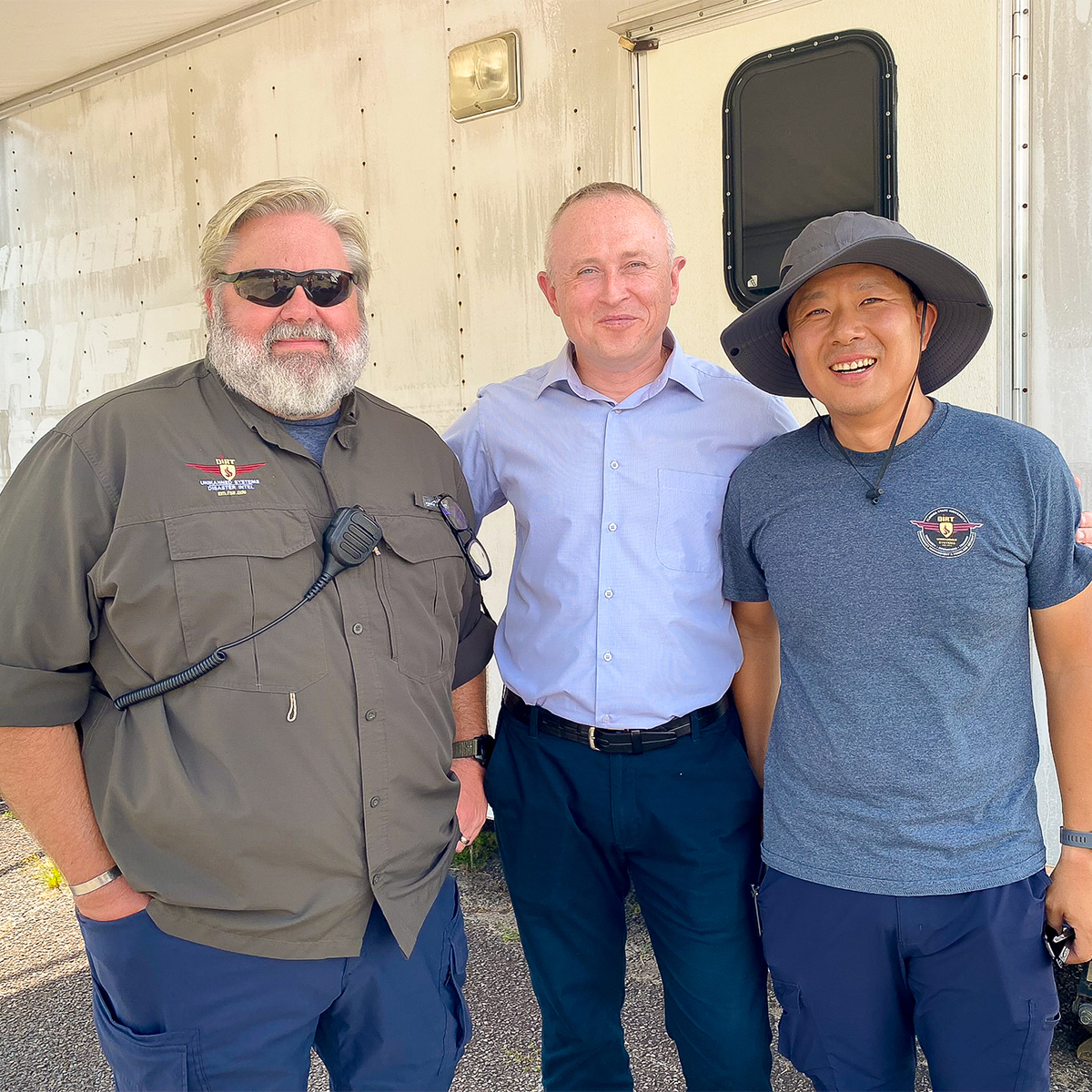 "Andrii Balendr posing with two members of FSU's Emergency Management team"